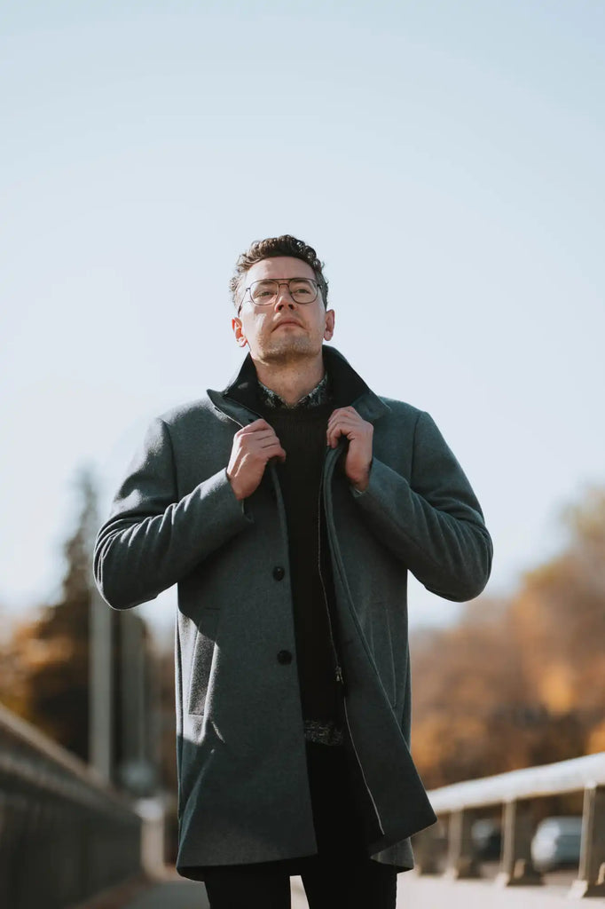 Man in gray overcoat.